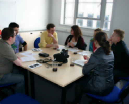 Focus group interview session. 6 participants are discussing.