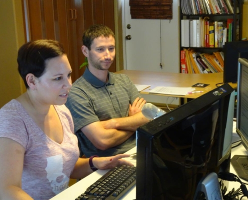 A male moderator and a female participant are seating next to each other at the User Testing Session