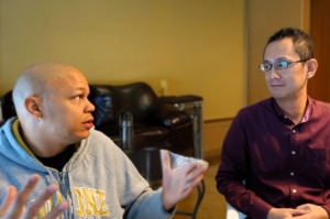 A participant is talking with the moderator at the user testing session